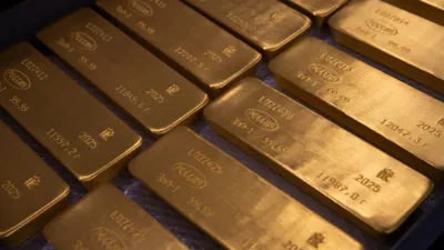 Gold falls to more than two-week low as oil rally fuels inflation worries