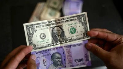 India's rupee forecast to weaken toward 100-per-dollar level even as RBI pushes back